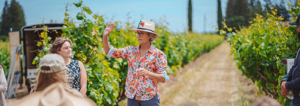 Organic farmer Heather Pyle-Lucas leading a vineyard training workshop with students in the field, part of CCOF’s organic education programs.